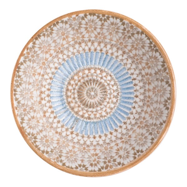 A round porcelain bowl with a blue and orange radial geometric design.