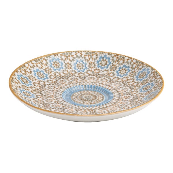 A round porcelain saucer with a blue and orange radial geometric design.