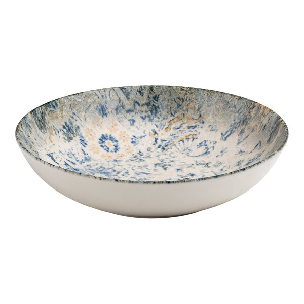 A round porcelain deep plate with a blue, white, and tan organic foliate design on the interior.