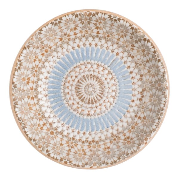A round blue porcelain ramekin with a radial geometric design.