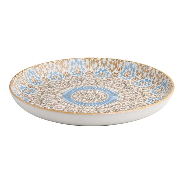 A round porcelain flat coupe plate with a blue and orange radial geometric design.