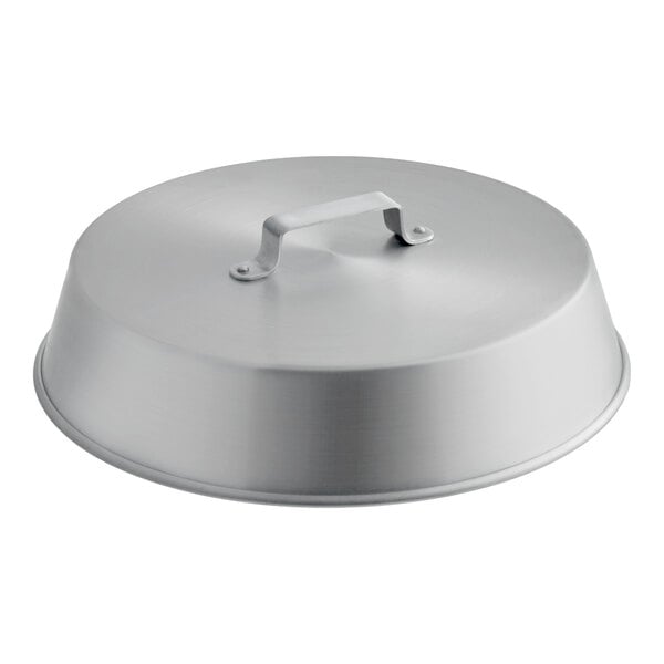 A round, metallic lid with a handle on top, likely made of aluminum.