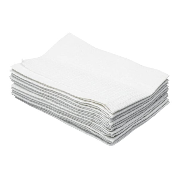 A stack of white, 2-ply moisture-resistant baby changing table liners.