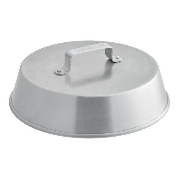 A round, metallic lid with a flat handle on top, likely made of aluminum.