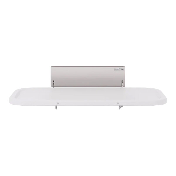 A wall-mounted adult changing station with a flat, rectangular surface and a metallic back panel.