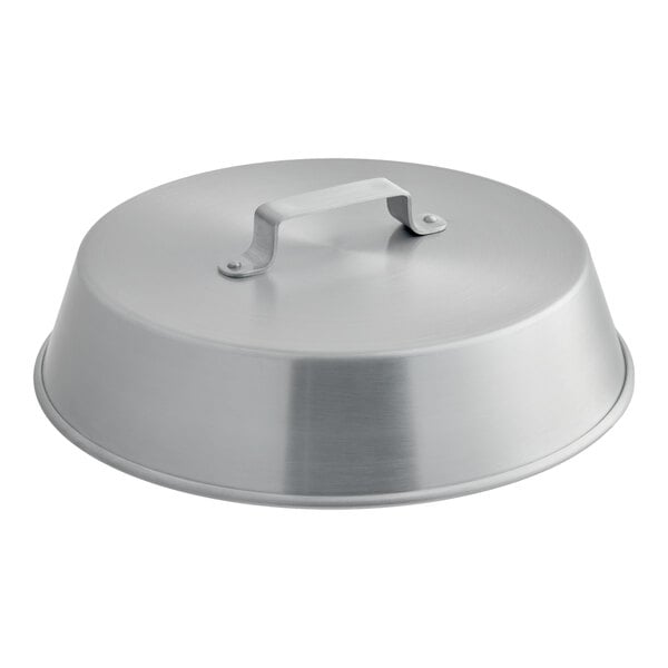 A round, metallic lid with a flat handle on top, likely made of aluminum.