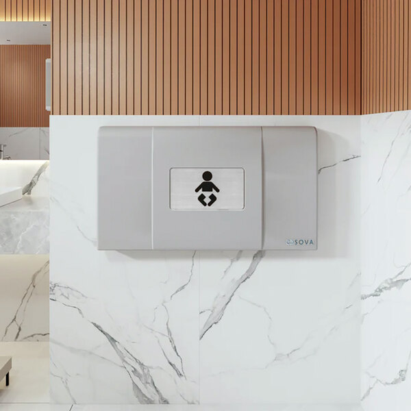 A light gray wall-mounted horizontal baby changing station with an EZ mount backer plate.