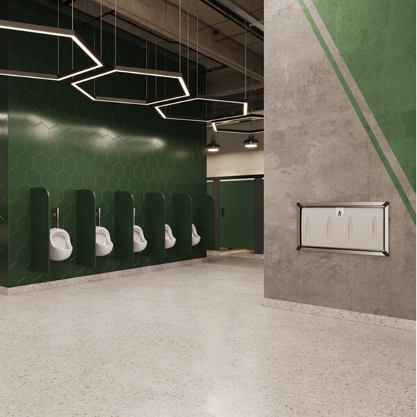 A light gray recessed horizontal baby changing station with a stainless steel frame mounted on a restroom wall.