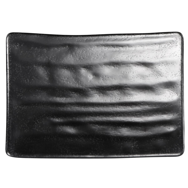 An Elite Global Solutions black rectangular plate with wavy lines.