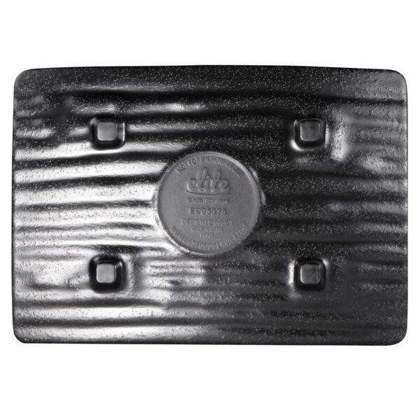 A close up of an Elite Global Solutions black rectangular plate with a square design.