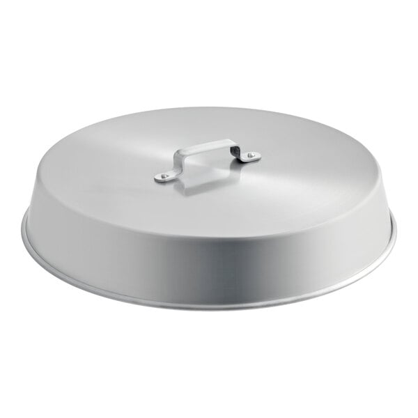 A round, metallic lid with a handle on top, likely made of aluminum.