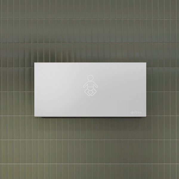 A frameless, surface-mounted horizontal stainless steel baby changing station attached to a tiled wall.