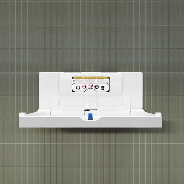 A white, wall-mounted, horizontal baby changing station with a frameless design.
