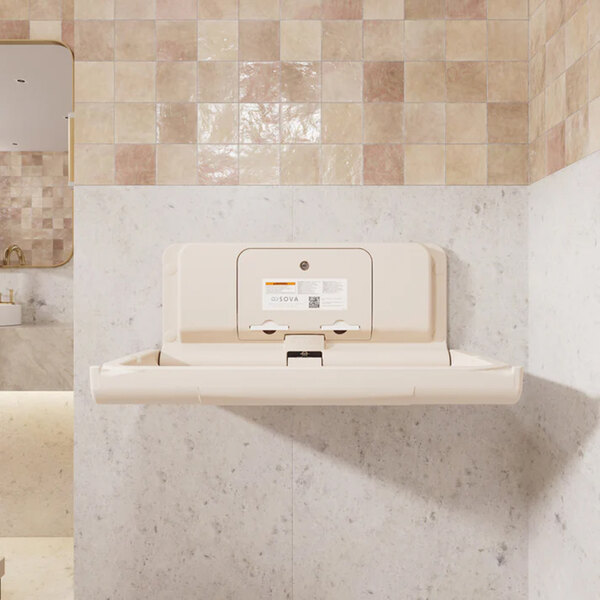 A beige wall-mounted horizontal baby changing station with an EZ Mount backer plate.