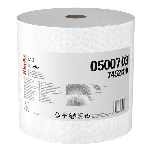 A large white roll of paper towels with a printed label featuring product information and barcodes.