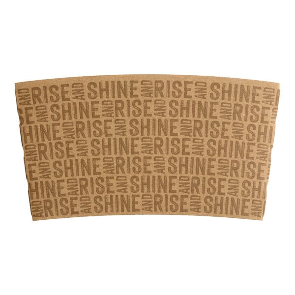 A brown coffee cup sleeve with the repeated phrase 'RISE AND SHINE' printed on it.