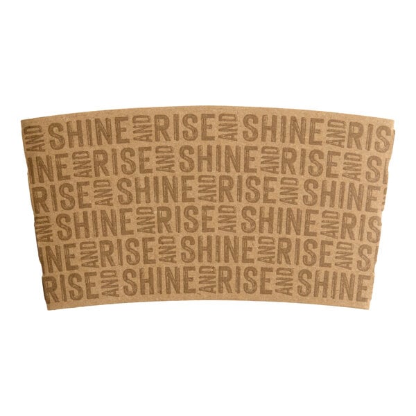 A brown coffee cup sleeve with the repeated phrase 'RISE AND SHINE' printed in bold letters.