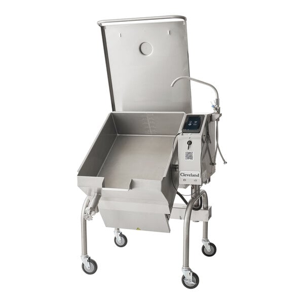 A large stainless steel commercial tilt skillet with an open base, control panel, and casters, featuring a raised lid and spout for pouring.