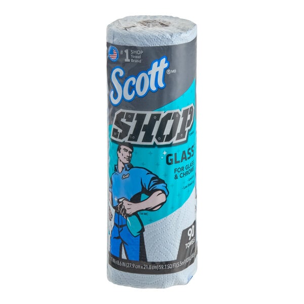A roll of Scott Shop Towels with blue and gray packaging featuring an illustrated worker holding a spray bottle.