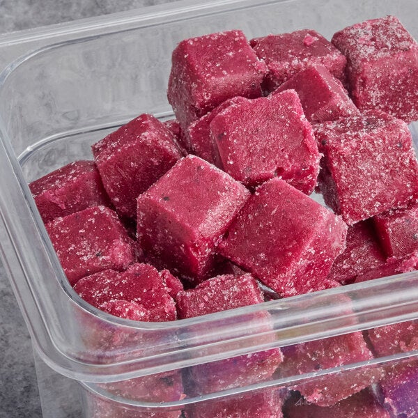 A container of frozen organic pitaya passion fruit smoothie cubes.