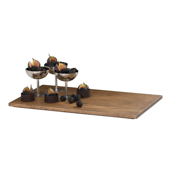 A rectangular chocolate brown oak wood flat tray.