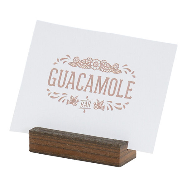 A small rectangular mocha-colored card holder made of HDPE, holding a printed card.