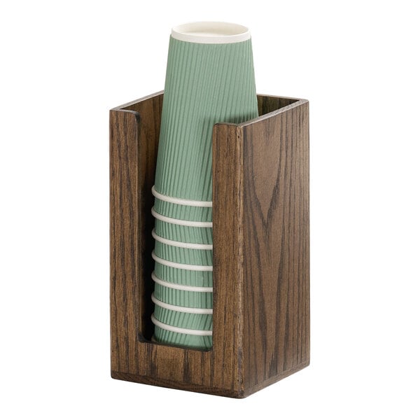 A chocolate brown oak wood countertop organizer holding a stack of green cups.