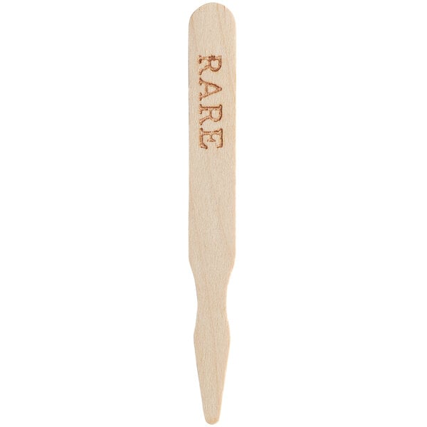 A wooden meat marker labeled 'RARE' for indicating steak doneness.