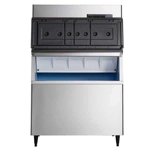 A commercial stainless steel ice machine with a storage bin and a black top panel.