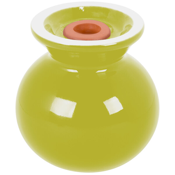 A yellow vase with a white top on a white square.