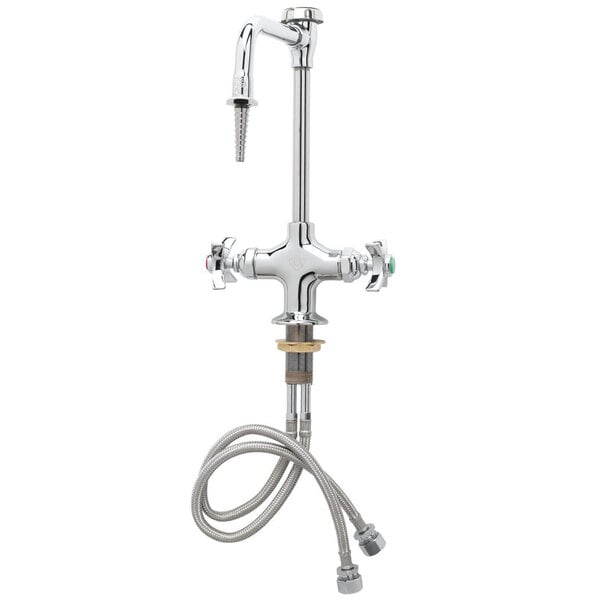 A close-up of a silver T&S laboratory faucet with flex inlets and white handles.