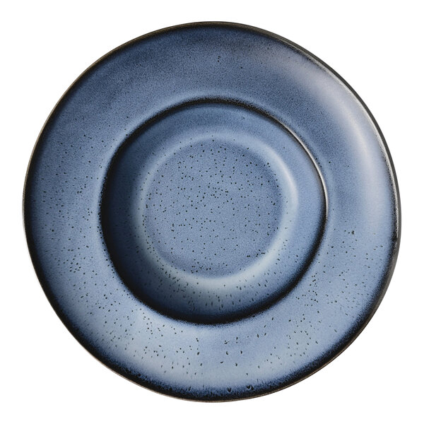 A round matte blue porcelain wide rim plate with a speckled design.
