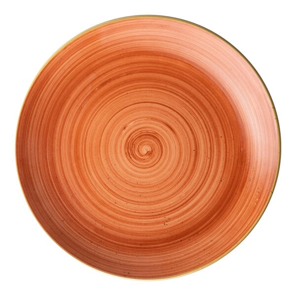 A round orange porcelain coupe plate with a swirl pattern.