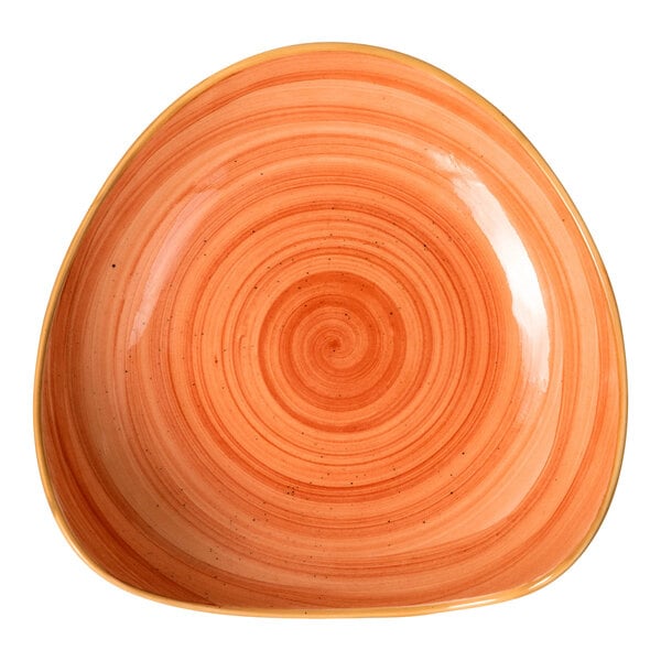 A triangular orange porcelain bowl with a swirl pattern.