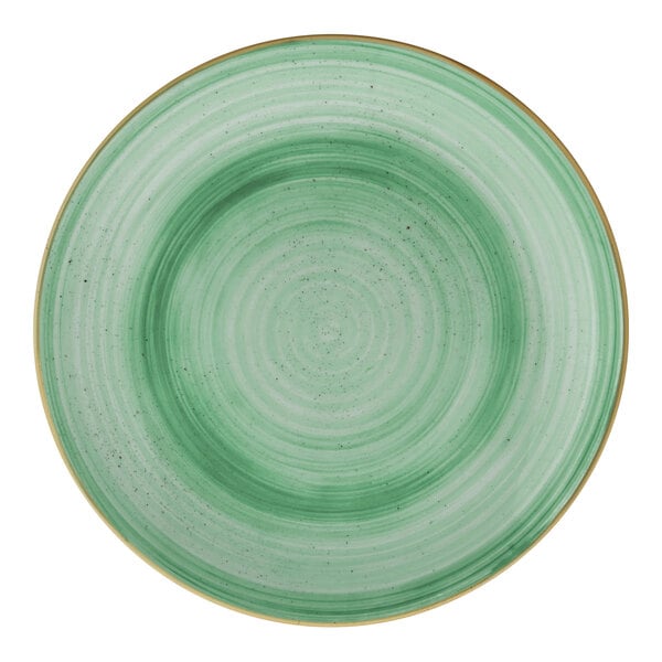 A round mint green porcelain coupe plate with a subtle concentric pattern.