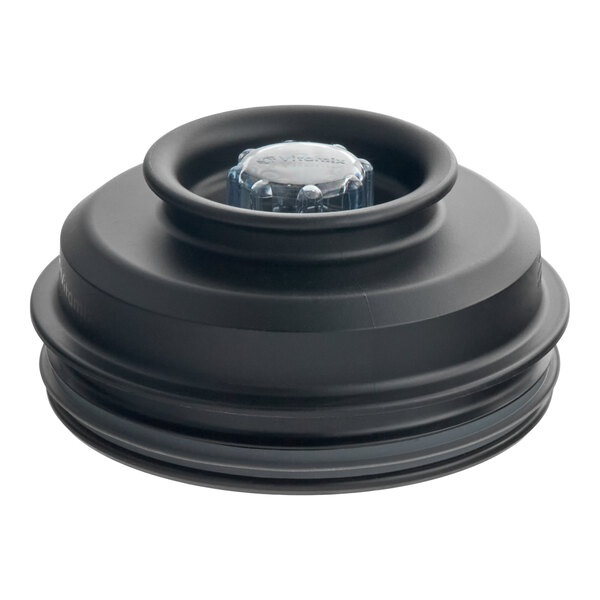 A black Vitamix splash lid with a clear plug designed for the Aer container jar.