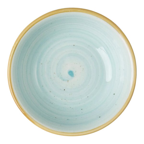 A light blue porcelain ramekin with a beige rim.