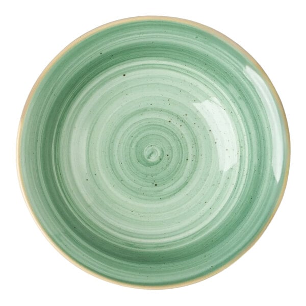 A round mint green porcelain ramekin with a swirl pattern.