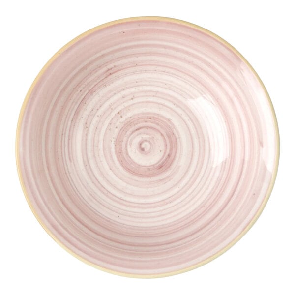 A pink porcelain ramekin with a circular, textured design.