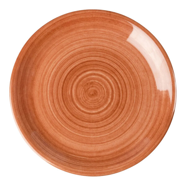 A round orange melamine coupe plate with a concentric circle pattern.