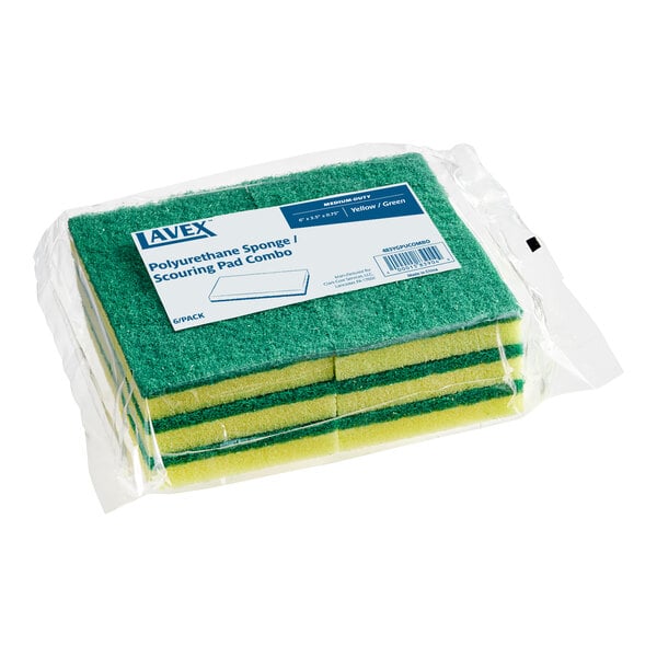 A package containing several yellow and green rectangular sponges with scouring pads, wrapped in clear plastic.