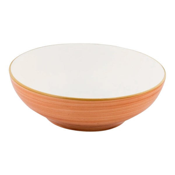 A round orange porcelain bowl with a white interior and a 32 oz. capacity.