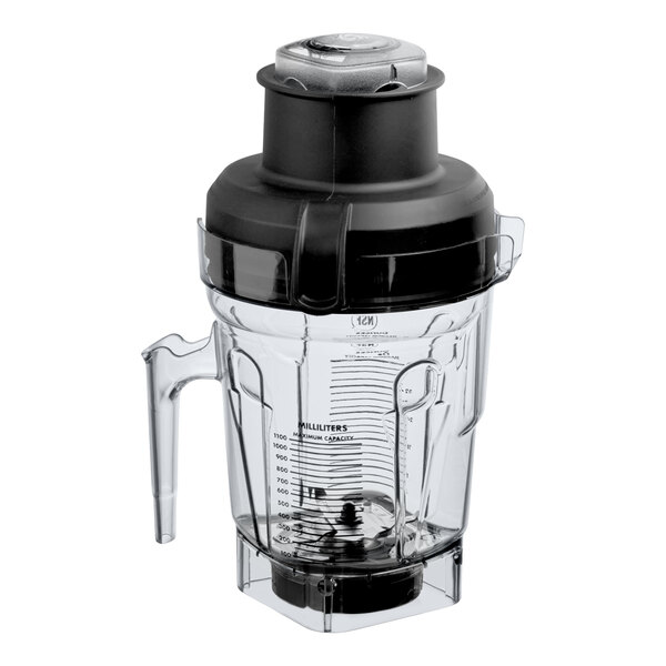 A clear 40 oz. Vitamix Eastman Tritan container jar with a black lid and dual blade assembly.