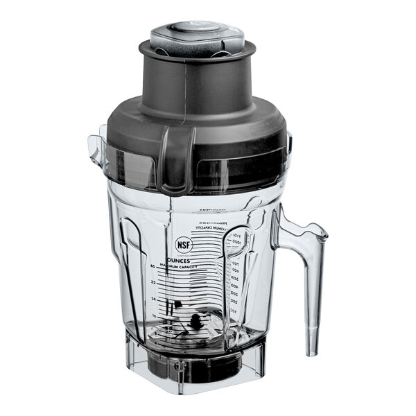 A clear 40 oz. Vitamix Eastman Tritan container jar with a handle, measurement markings, and a black lid, featuring a dual blade assembly at the base.