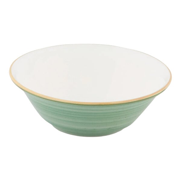 A round porcelain bowl with a mint green exterior and white interior.