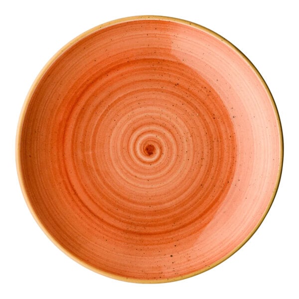 A round orange porcelain coupe plate with a concentric circle design.