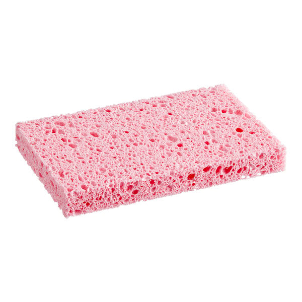 A rectangular pink sponge with a porous texture is shown against a white background.