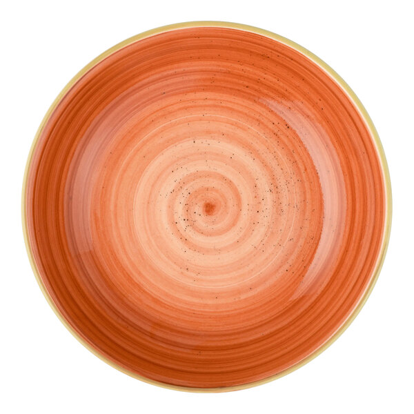An orange round deep coupe plate with a concentric circle design.