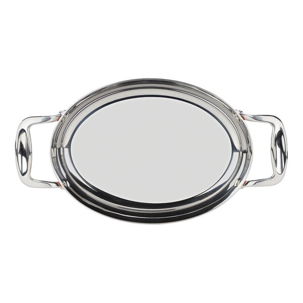 A stainless steel oval roasting pan with handles on each side.