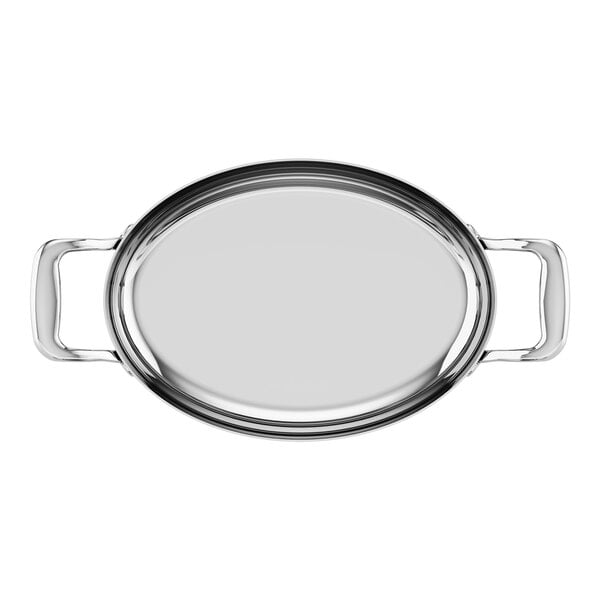 A stainless steel oval roasting pan with handles on each side.